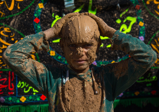 Iranian Shiite Muslim Boy Covered In Mud During Ashura, The Day Of The Death Of Imam Hussein, Kurdistan Province, Bijar, Iran