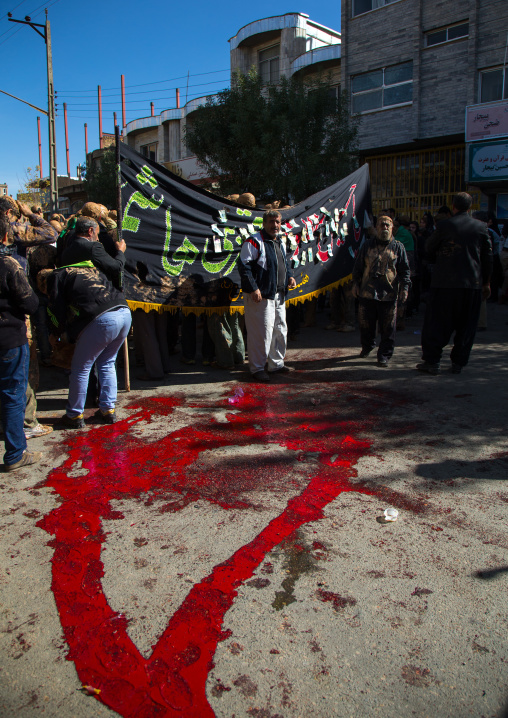 Shiite Muslim Men Standing In The Blood Of A Ritually Slaughtered Sheep On Ashura, The Day Of The Death Of Imam Hussein, Kurdistan Province, Bijar, Iran