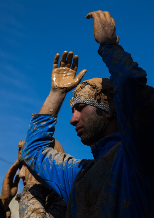 Iranian Shiite Muslim Men Covered In Mud, Chanting And Self-flagellating During Ashura, The Day Of The Death Of Imam Hussein, Kurdistan Province, Bijar, Iran