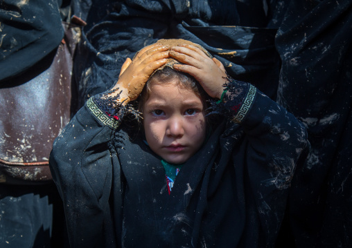 Iranian Shiite Muslim Girl Covered In Mud, Chanting And Self-flagellating During Ashura, The Day Of The Death Of Imam Hussein, Kurdistan Province, Bijar, Iran