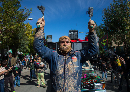 Iranian Shiite Man Covered In Mud Is Beating Himself With Iron Chains To Commemorate Ashura, The Day Of The Death Of Imam Hussein, Kurdistan Province, Bijar, Iran