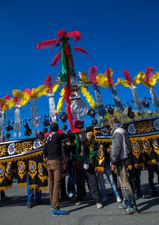 An Iranian Man Carries An Alam Is Helped By Shiite Muslim Mourners To Keep His Balance On Ashura, The Day Of The Death Of Hussein, Kurdistan Province, Bijar, Iran