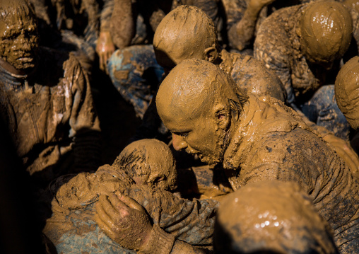 Iranian Shiite Muslim Men Covered In Mud Crying Together During Ashura, The Day Of The Death Of Imam Hussein, Kurdistan Province, Bijar, Iran