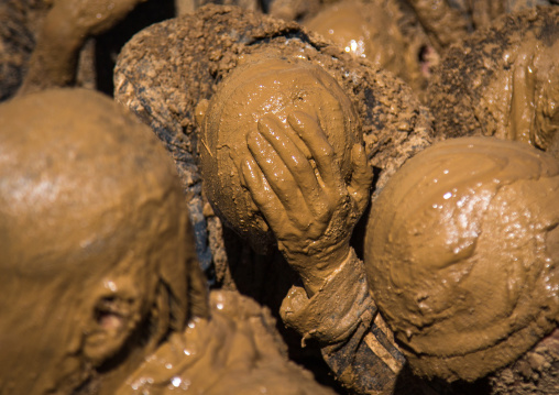 Iranian Shiite Muslim Men Covered In Mud Crying Together During Ashura, The Day Of The Death Of Imam Hussein, Kurdistan Province, Bijar, Iran
