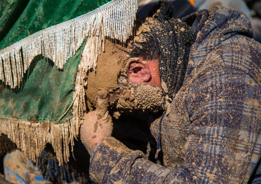 Iranian Shiite Muslim Man Covered In Mud Crying During Ashura Day, Kurdistan Province, Bijar, Iran