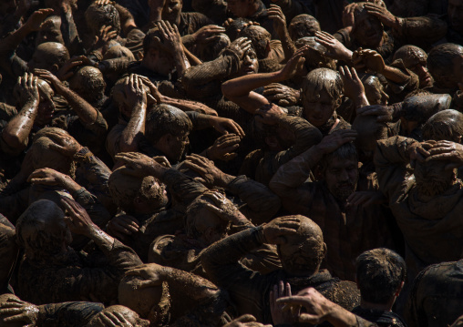 Iranian Shiite Muslim Men Covered In Mud, Chanting And Self-flagellating During Ashura, The Day Of The Death Of Imam Hussein, Kurdistan Province, Bijar, Iran