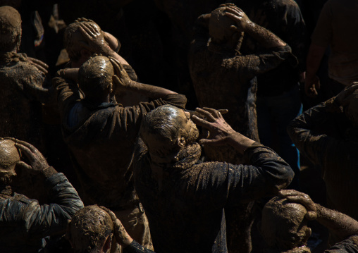 Iranian Shiite Muslim Men Covered In Mud, Chanting And Self-flagellating During Ashura, The Day Of The Death Of Imam Hussein, Kurdistan Province, Bijar, Iran