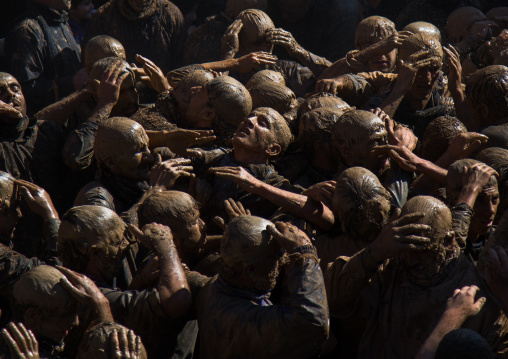 Iranian Shiite Muslim Men Covered In Mud, Chanting And Self-flagellating During Ashura, The Day Of The Death Of Imam Hussein, Kurdistan Province, Bijar, Iran