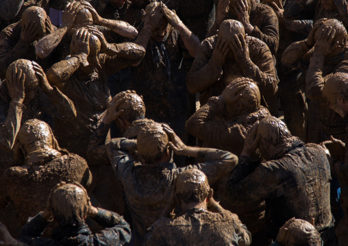 Iranian Shiite Muslim Men Covered In Mud, Chanting And Self-flagellating During Ashura, The Day Of The Death Of Imam Hussein, Kurdistan Province, Bijar, Iran