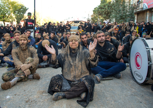 Iranian Shiite Muslim Woman Covered In Mud Praying In The Middle Of Men During Ashura Day, Kurdistan Province, Bijar, Iran