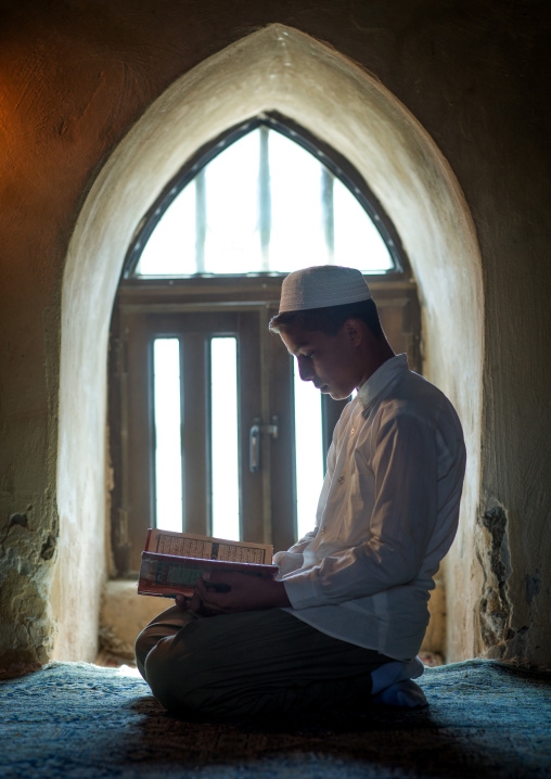 Iranian Shiite Muslim Student Reading The Koran In A Madrassah, Golestan Province, Karim Ishan, Iran