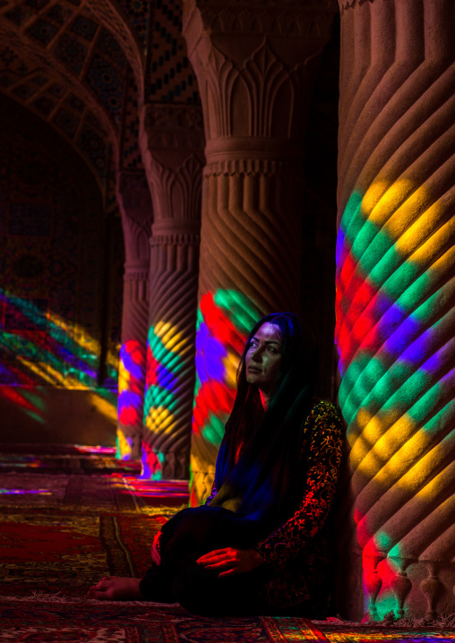 Iranian Woman Praying In The Nasir Ol Molk Mosque With Its Beautiful Coloured Glass Windows, Fars Province, Shiraz, Iran