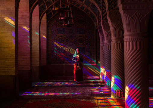 Iranian Woman In The Nasir Ol Molk Mosque With Its Beautiful Coloured Glass Windows, Fars Province, Shiraz, Iran