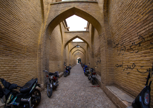 Motorbikes Parked Along A Narrow Street With Arches, Fars Province, Shiraz, Iran