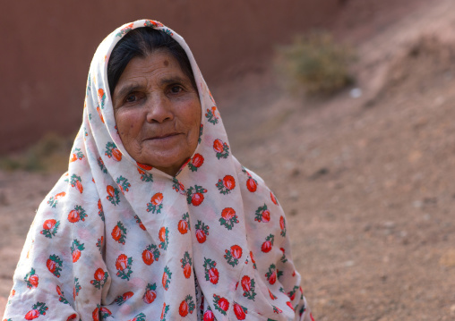 Portrait Of An Iranian Woman Wearing Traditional Floreal Chador In Zoroastrian Village, Isfahan Province, Abyaneh, Iran