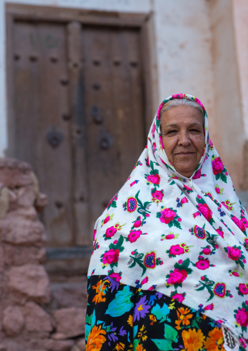 Portrait Of An Iranian Woman Wearing Traditional Floreal Chador In Zoroastrian Village, Isfahan Province, Abyaneh, Iran