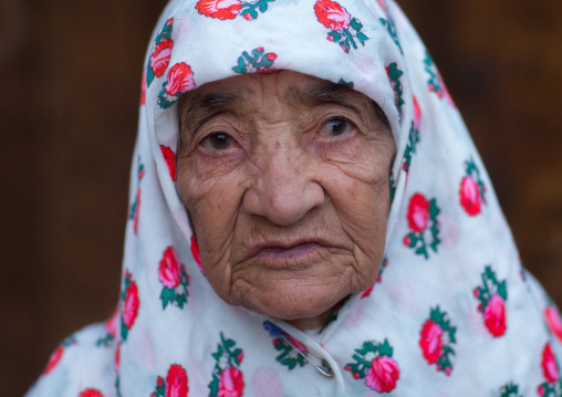 Portrait Of An Iranian Woman Wearing Traditional Floreal Chador In Zoroastrian Village, Isfahan Province, Abyaneh, Iran