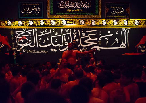 Iranian Shiite Muslim Man Leading Recitations And Songs With The Mad Of Hussein Mourners During Muharram, Isfahan Province, Kashan, Iran