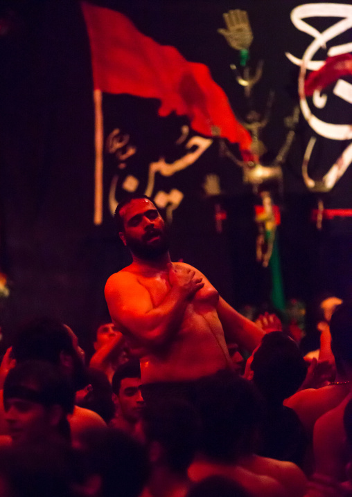 Iranian Shiite Muslim Man Leading Recitations And Songs With The Mad Of Hussein Mourners During Muharram, Isfahan Province, Kashan, Iran