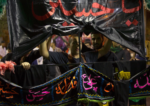 Iranian Shiite Muslim Man Carries An Alam In The Street During Muharram, Isfahan Province, Kashan, Iran