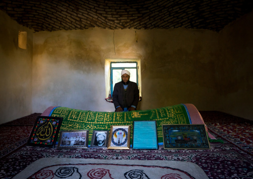 Iranian Shiite Iman Praying Inside A Shrine In Front Of A Tomb, Golestan Province, Karim Ishan, Iran
