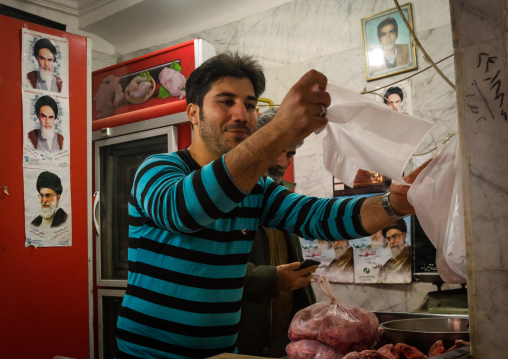 Butcher In His Shop Decorated With Ayatollah Khomeini Pictures, Golestan Province, Gorgan, Iran
