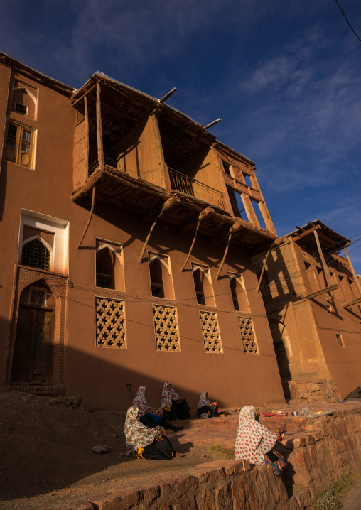Old Women In Front Of Ancient Building In Zoroastrian Village, Isfahan Province, Abyaneh, Iran