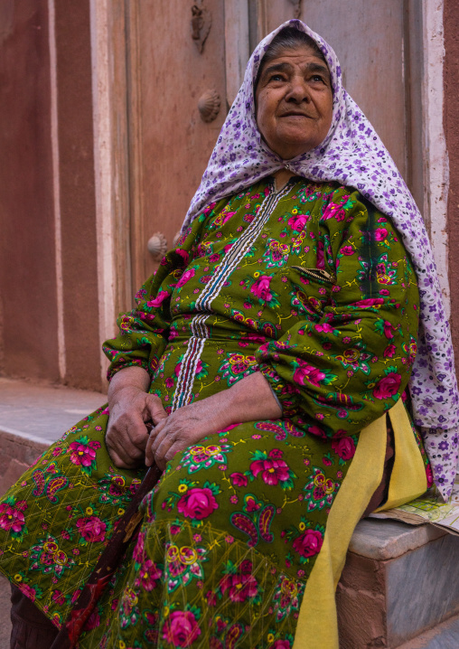 Portrait Of An Iranian Woman Wearing Traditional Floreal Chador In Zoroastrian Village, Isfahan Province, Abyaneh, Iran