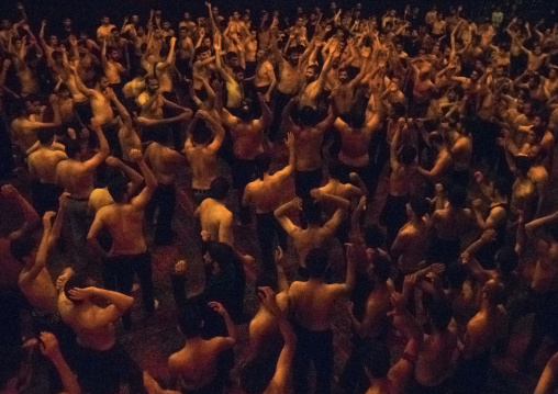 Iranian Shiite Muslim Mourners From The Mad Of Hussein Community Chanting And Self-flagellating In Circle During Muharram, Isfahan Province, Kashan, Iran