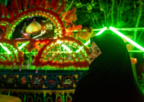 Iranian Shiite Muslim Woman Mourner Pausing Proudly In Front Of An Alam On Ashura, The Day Of The Death Of Imam Hussein, Isfahan Province, Kashan, Iran