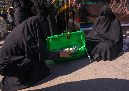 A Shiite Muslim Woman Collecting Money In A Green Craddle On The Day Of Tasua, Lorestan Province, Khorramabad, Iran