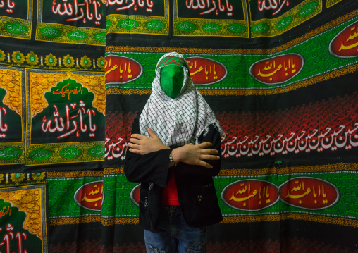 Iranian Young Man With Green Veil Covering His Face During Chehel Menbari Festival On Tasua To Commemorate The Martyrdom Of Hussein, Lorestan Province, Khorramabad, Iran