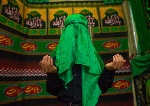 Iranian Young Man With Green Veil Covering His Face During Chehel Menbari Festival On Tasua To Commemorate The Martyrdom Of Hussein, Lorestan Province, Khorramabad, Iran