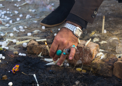 A Man Lights Candles During Chehel Menbari Festival On Tasu'a Day To Commemorate The Martyrdom Anniversary Of Imam Hussein, Lorestan Province, Khorramabad, Iran