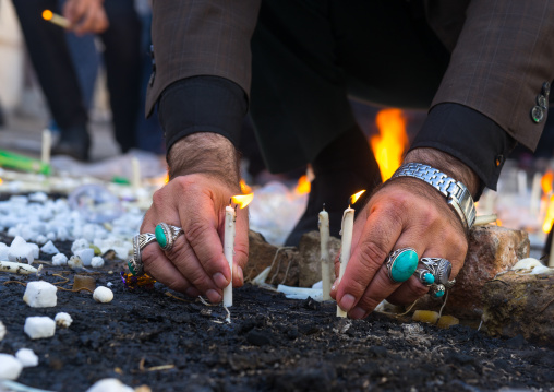 A Man Lights Candles During Chehel Menbari Festival On Tasu'a Day To Commemorate The Martyrdom Anniversary Of Imam Hussein, Lorestan Province, Khorramabad, Iran