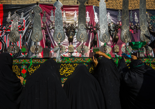 Iranian Shiite Women Putting Green Ribbons On An Alam To Make Wishes During Chehel Menbari Festival On Tasua Day, Lorestan Province, Khorramabad, Iran