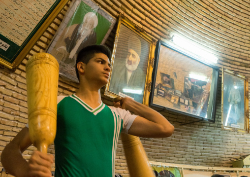 Iranian Man Wielding Wooden Clubs During The Traditional Sport Of Zurkhaneh, Yazd Province, Yazd, Iran
