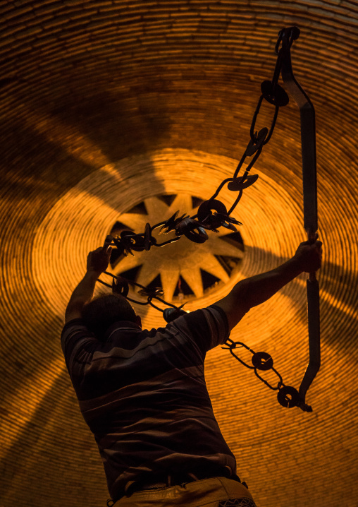 Iranian Man Training With Kabbadeh Chain And Bow At Saheb A Zaman Club Zurkhaneh, Yazd Province, Yazd, Iran