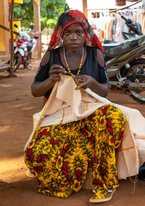 Senufo woman sewing in a market, Savanes district, Waraniene, Ivory Coast