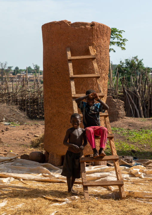 African children repairing a granary, Savanes district, Niofoin, Ivory Coast