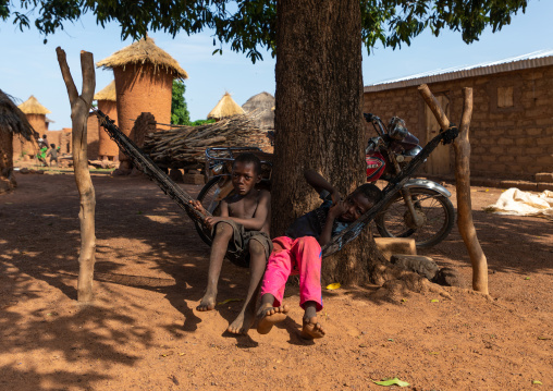 Senufo children resting on a hammock in a village, Savanes district, Niofoin, Ivory Coast