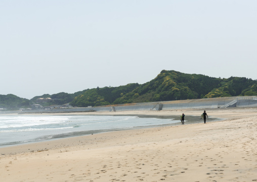 Japanese surfers in the contaminated area after the daiichi nuclear power plant irradiation, Fukushima prefecture, Tairatoyoma beach, Japan