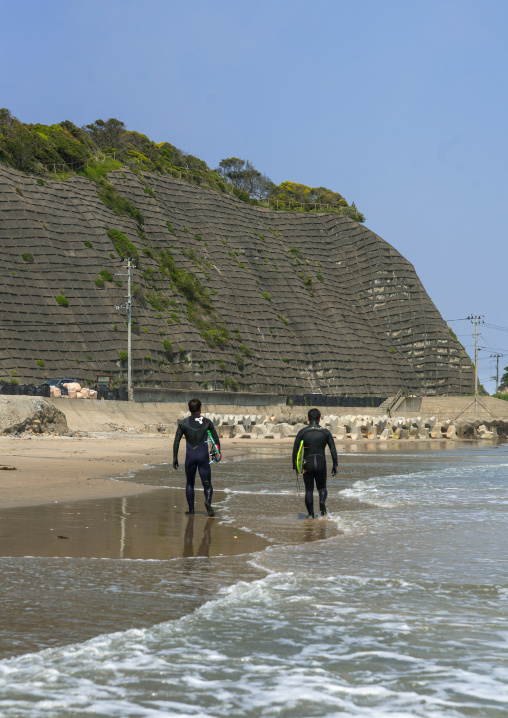 Japanese surfers in the contaminated area after the daiichi nuclear power plant irradiation, Fukushima prefecture, Tairatoyoma beach, Japan