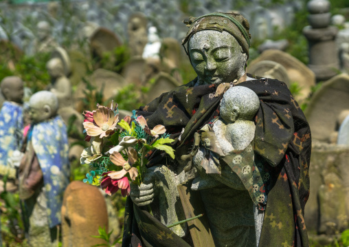 Stone baby statues called jizobosatsu protecting the souls of aborted children after the tsunami, Fukushima prefecture, Tairatoyoma beach, Japan