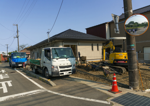 Workers remove top soil contaminated by nuclear radiations of an abandoned house in the highly contaminated area, Fukushima prefecture, Naraha, Japan
