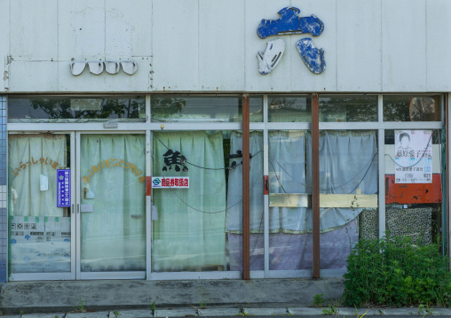 Abandoned restaurant with a no yakusa entry sign in the highly contaminated area after the daiichi nuclear power plant irradiation, Fukushima prefecture, Naraha, Japan