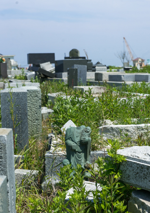 The remains of a destroyed cemetery after the 2011 earthquake and tsunami, Fukushima prefecture, Namie, Japan