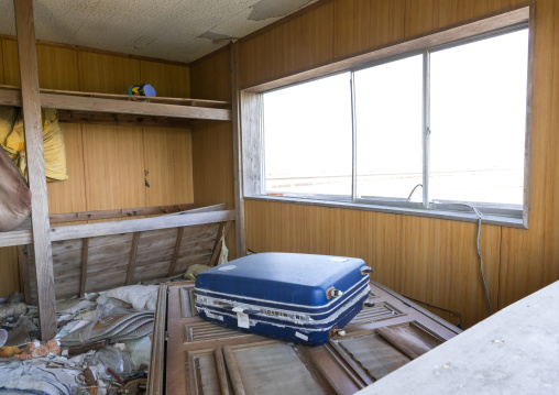 A suitcase inside a house destroyed by the 2011 earthquake and tsunami five years after, Fukushima prefecture, Namie, Japan