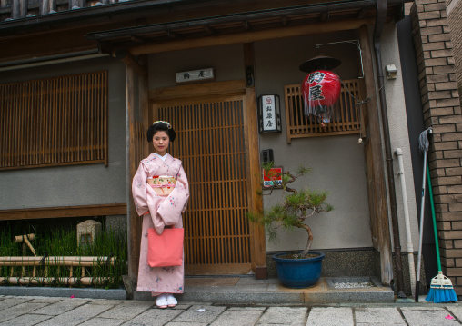 16 Years old maiko called chikasaya in front of the geisha house where she lives, Kansai region, Kyoto, Japan