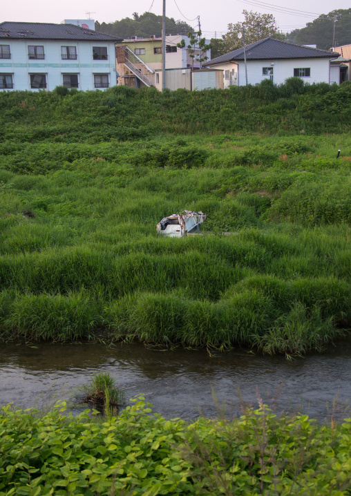 A destroyed and abandoned car by 2011 tsunami, Fukushima prefecture, Tomioka, Japan